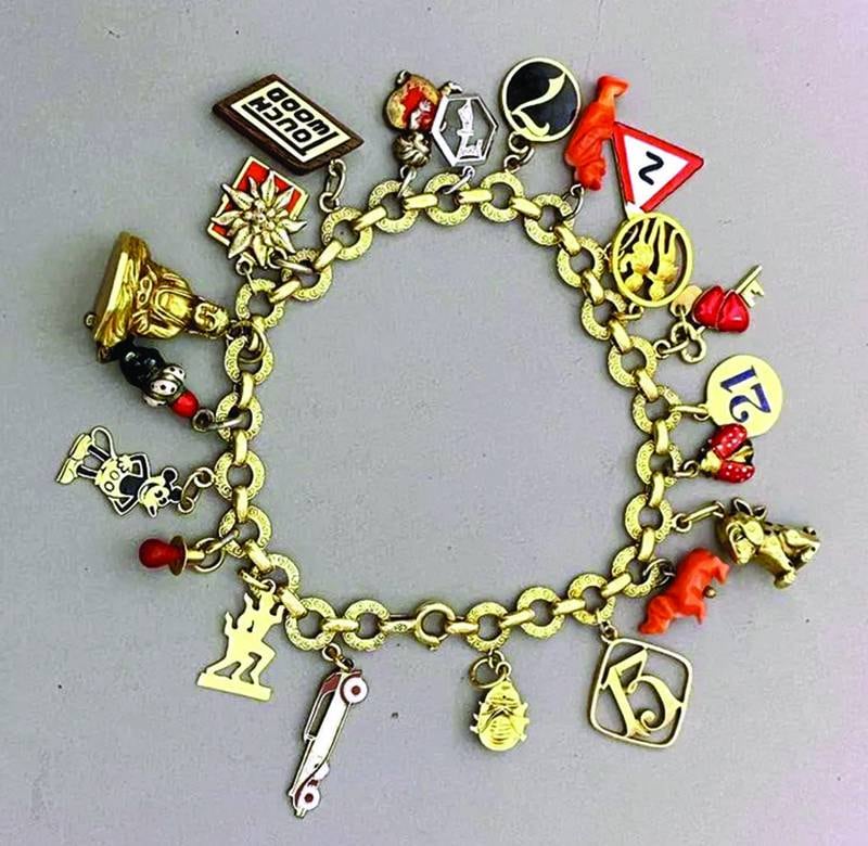A charm bracelet can act as a wearable small-scale version of a collection.