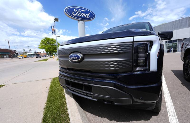 An unsold 2024 Lightning electric pickup truck sits at a Ford dealership in Denver.