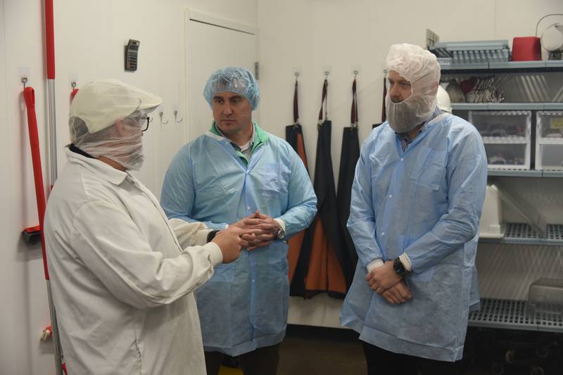 Food Safety and Inspection Service leaders Robert Bane (from right) and Robert Witte toured Old Major Market and Turchetti's Meats to see food safety in action in Indiana.
