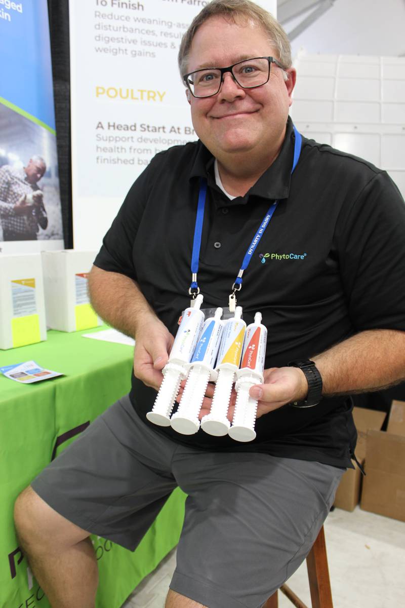 Robert Tims shows the new PhytoCare paste products for ruminant animals at his exhibitor booth during the World Dairy Expo. The dial on the tube can be rotated to dispense an accurate amount of product on the back of a calf’s tongue.