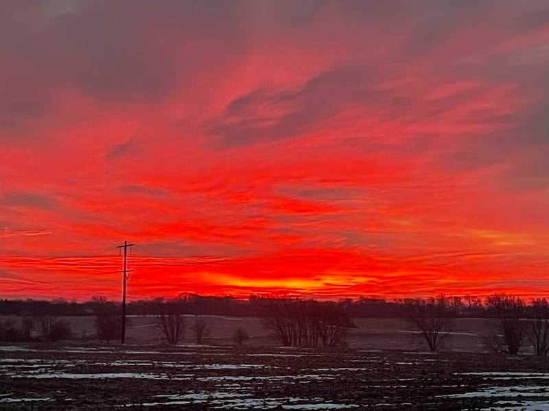 We get the AgriNews newspaper every week and I took this picture of the sunrise on Christmas Eve morning. I have shared it with several people — and many of them have said it’s one of the most beautiful sunrises they have ever seen, and I agree. I think God is an amazing artist. We live in the northern part of Illinois, just east of the town of Winnebago. I feel so fortunate to be able to live in a place where the view is not obstructed by tall buildings and lots of houses so that I can have the opportunity to photograph the sunrise. I hope you have a very happy New Year.