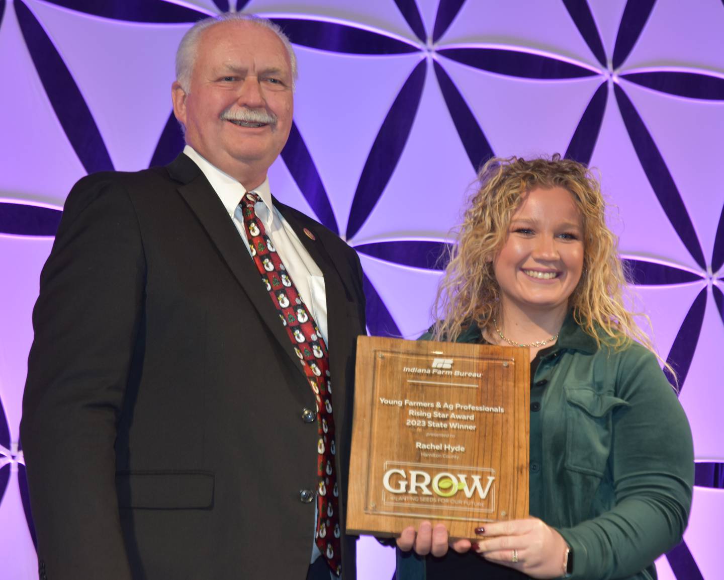 Receiving the new Rising Star Award, which honors outstanding members who are active in Indiana Farm Bureau, their county, their community, Collegiate Farm Bureau and/or Young Farmers & Ag Professionals programs, as well as display personal and professional growth by participating in those activities, Rachel Hyde will get a $2,000 cash prize and an all-expenses-paid trip in March to the American Farm Bureau Federation’s Young Farmers & Ranchers Leadership Conference in Omaha, Nebraska. She was given the award at the INFB State Convention by INFB President Randy Kron.