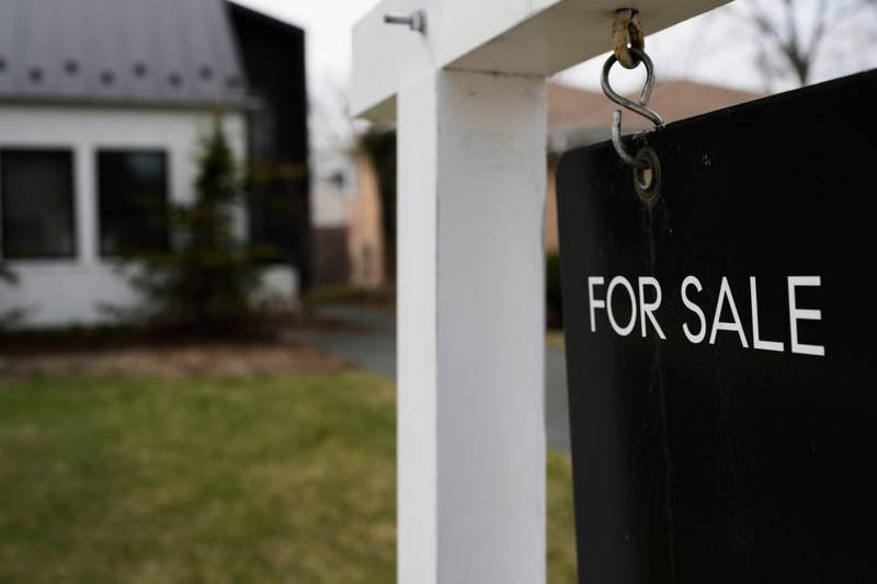 A House For Sale sign is displayed in front of a home in Evanston, Illinois.