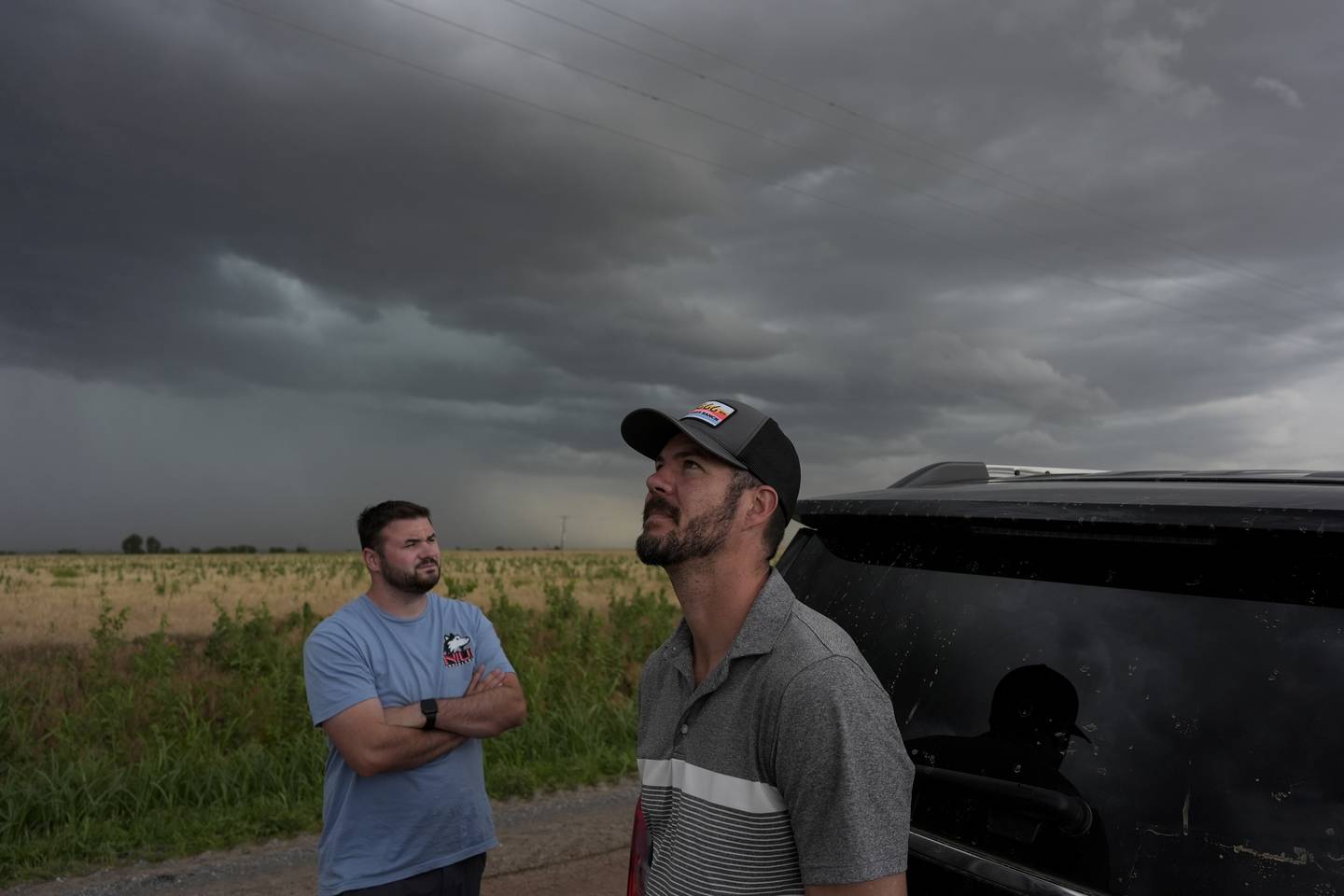 Victor Gensini (right), Northern Illinois University meteorology professor and a lead scientist of Project ICECHIP, and Logan Bundy, Ph.D. candidate at NIU and ICECHIP IOP assistant, look at cloud formations during a Project ICECHIP operation.