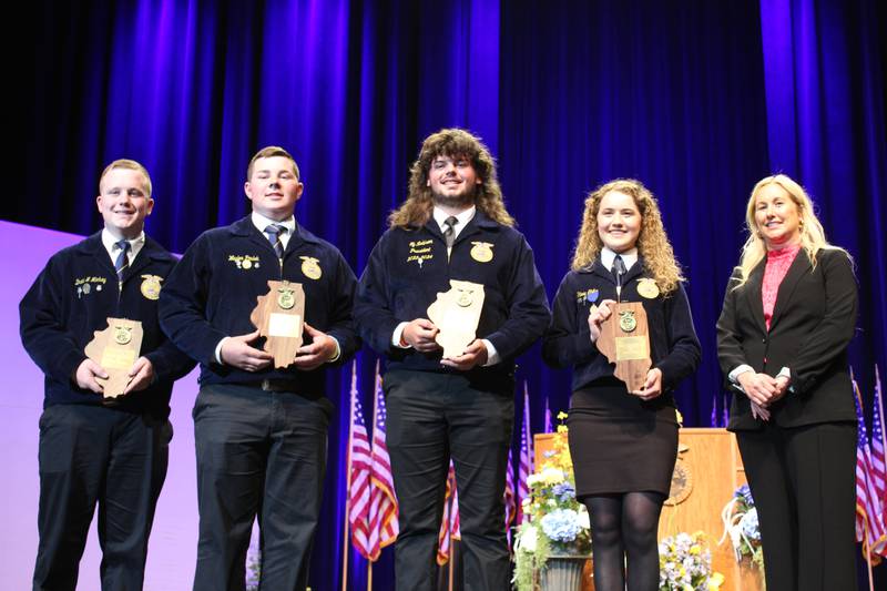 Kristi Jones (far right), deputy director of the Illinois Department of Agriculture, presents Star awards to FFA members during the state convention. Members receiving these prestigious honors include: Drew Mickey (from left), Star Farmer; Waylon Paulek, Star in Agricultural Placement; Ty Robison, Star in Agribusiness; and Olivia Shike, Star in Agriscience.