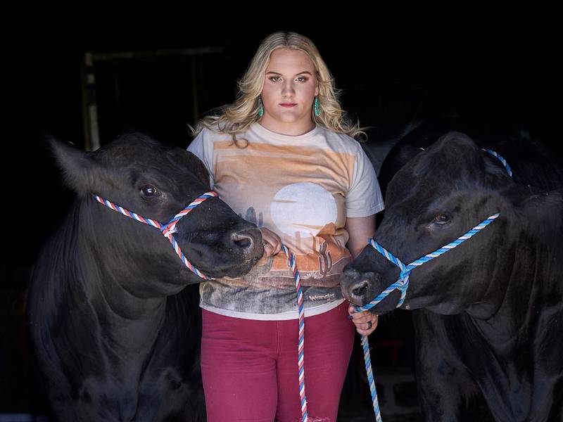 “Who’s The Boss” — Latonia Richey: “2023 senior picture of my daughter with their 4-H steers. Each was nearly 1,300 pounds and they trusted her completely.”
