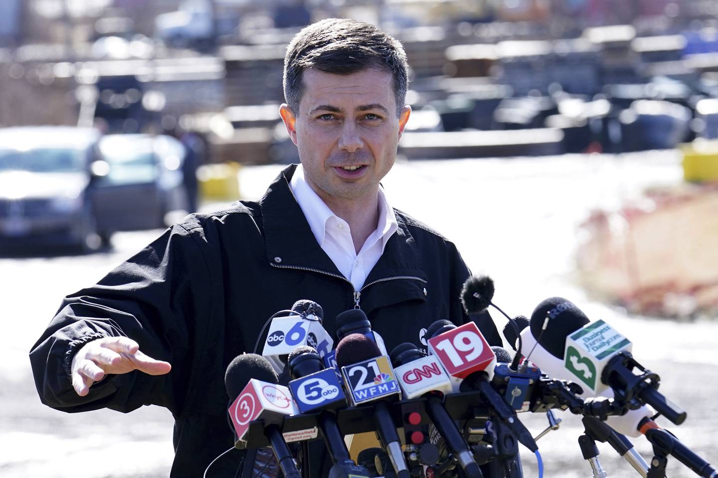 Transportation Secretary Pete Buttigieg speaks during a news conference in February 2023 near the site of the Norfolk Southern train derailment in East Palestine, Ohio.