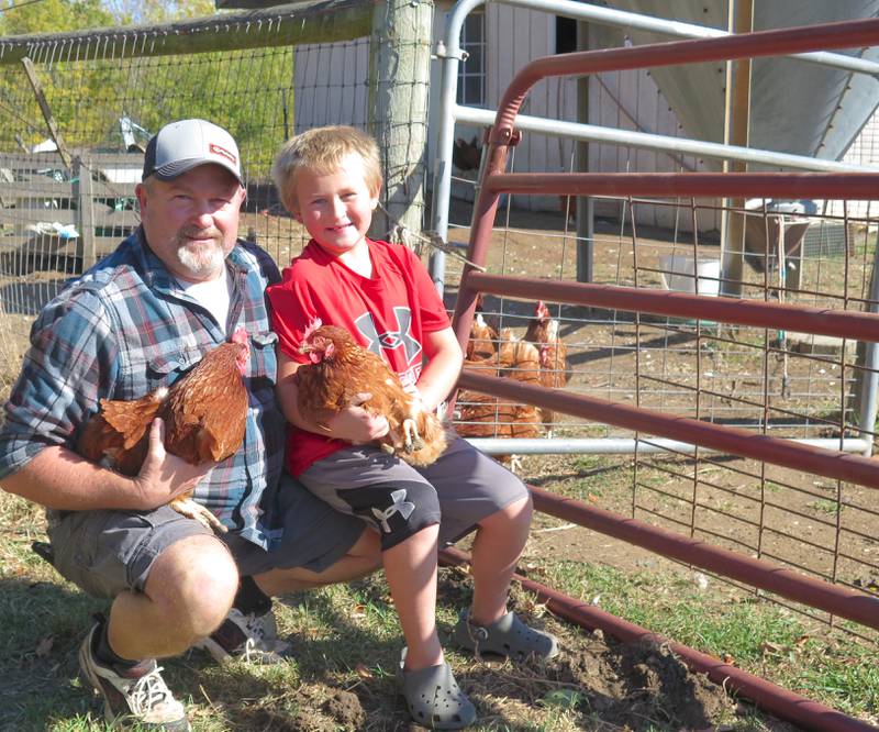 Brad Dearing and his son, Peyton, check on the 400 egg-laying hens at Dearing Country Farms, just west of Bloomington in central Illinois. Dearing and his wife, Jackie, purchased the farm in 2003 and it has since grown to a diverse operation with egg and meat chickens, turkeys, beef cattle, goats and sheep. The organic farm also has fruit trees, berries and a variety of shrubs to later harvest for additional products and a two-acre vegetable garden.