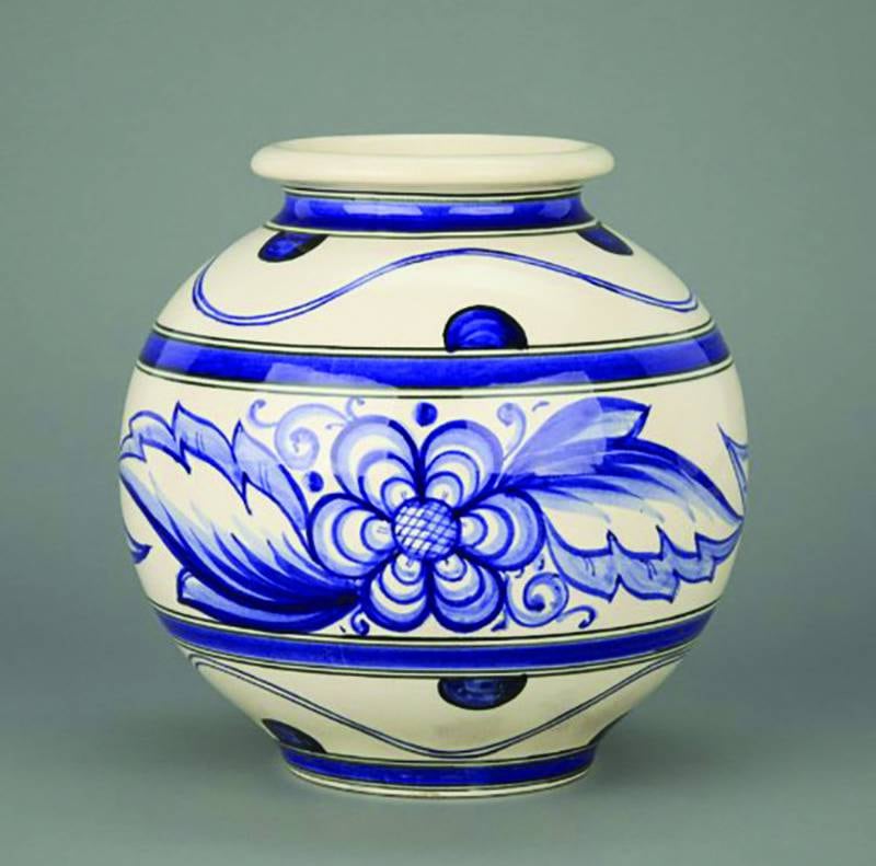 This vase is from Weller Pottery's DeDonatis line, named after creator Francesco DeDonatis and inspired by pottery from his home country of Italy.