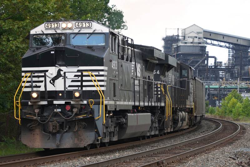 A Norfolk Southern freight train rolls past the U.S. Steel's Clairton Coke Works in Clairton in southwestern Pennsylvania.