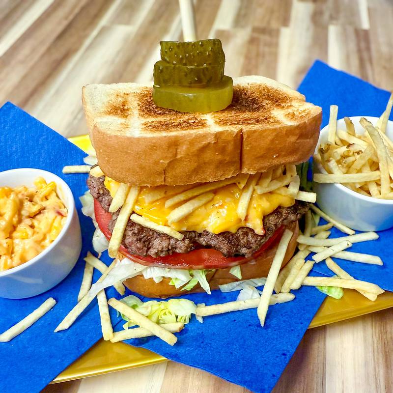 Yes Cer’s Burger by Red Frazier Bison. A twist on the classic burger, this hearty bison burger comes stacked with rich pimento cheese, crunchy potato sticks and tangy horseradish pickles - all nestled between two thick slices of buttery Texas toast.