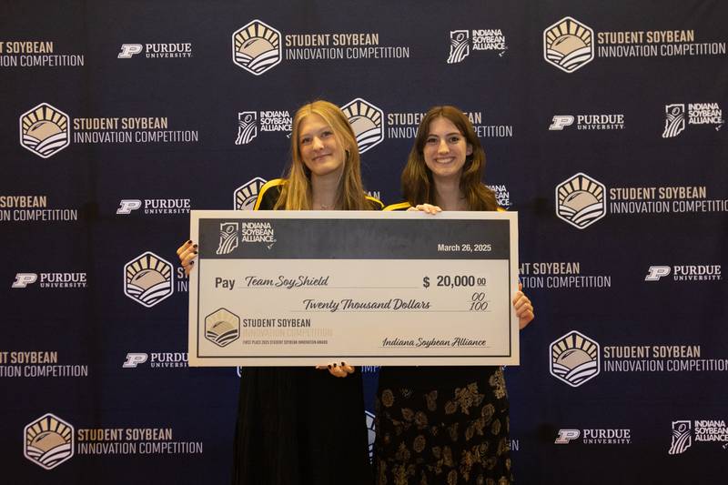 Taking the $20,000 top prize in the Student Soybean Innovation Competition were the creators of SoyShield, a self-adhesive, lab-grade and food-grade film. The winning team includes Leah Hartzell (from left) of Miami, Florida, and Claire Eckhardt of Albuquerque, New Mexico. A third team member, Nicholas Emge of O’Fallon, Missouri, could not attend the ceremony because he is studying abroad.