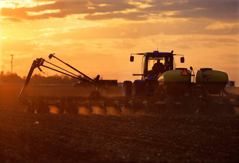 A farmer races against a setting sun to plant seed corn near Ashland in west-central Illinois.
