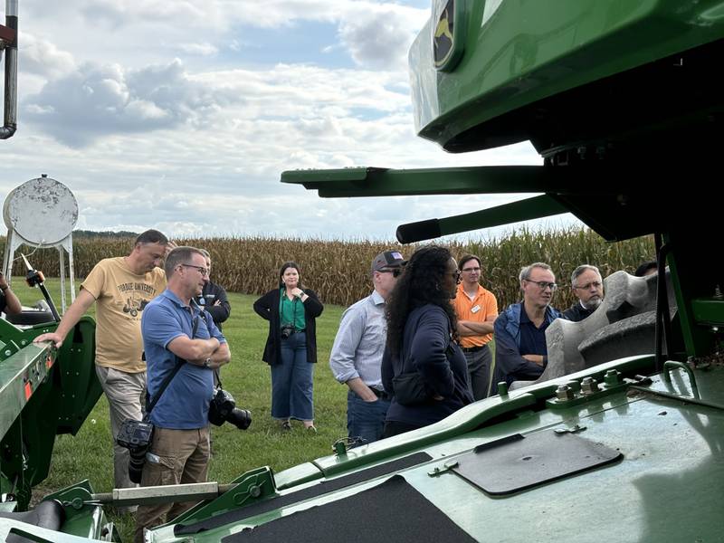 Agricultural delegates from around the world visit Isabella Chism’s farm.