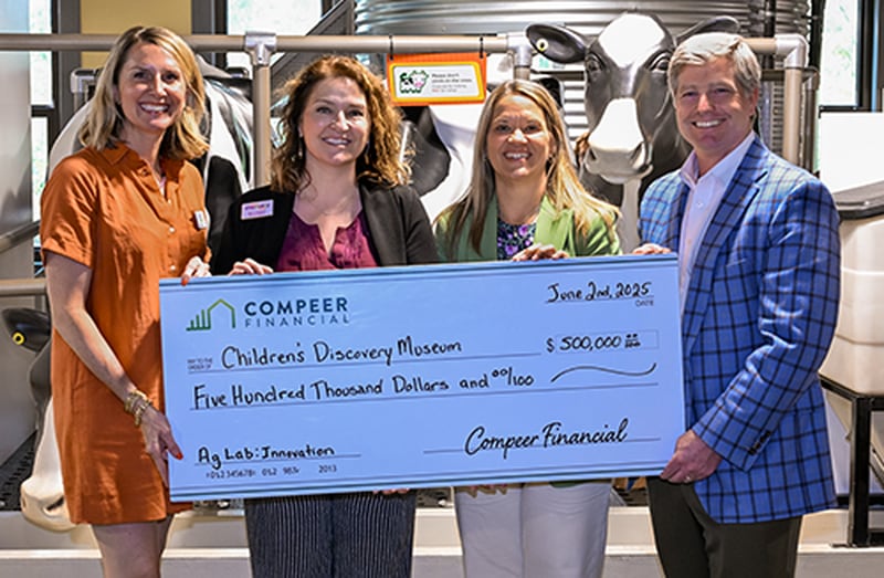 Jase Wagner, president and CEO of Compeer Financial, announces a $500,000 gift to the Children’s Discovery Museum in Normal, Illinois. Participants in the presentation included Lauren Lurkins (from left), Children’s Discovery Museum Foundation board member; Beth Whisman, Children’s Discovery Museum executive director; Karen Schieler, manager of Compeer Financial’s Fund for Rural America and Giving; and Wagner.