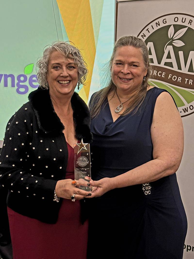 Vikkie Becker (left) receives the 2025 Rising Star Award from Rose Tryon, 2023-2025 American Agri-Women president.