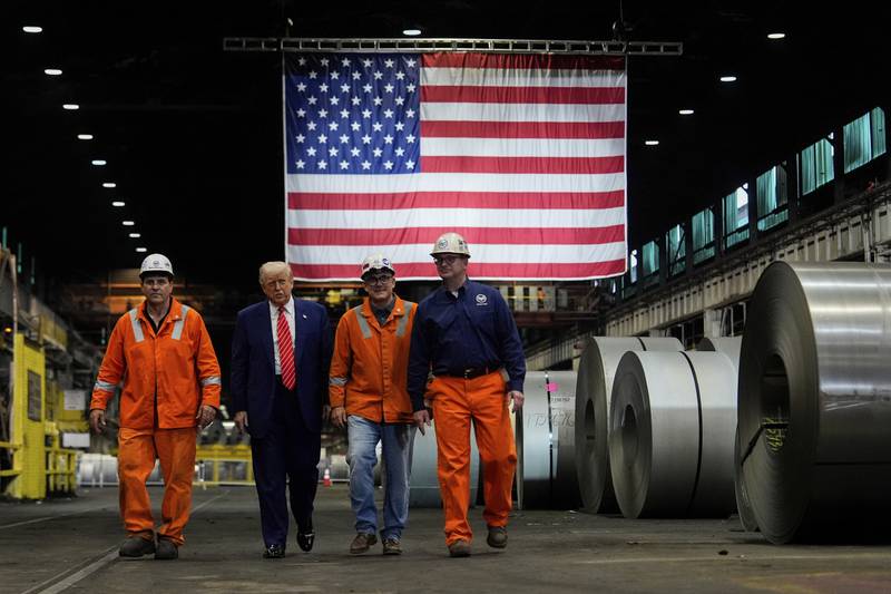President Donald Trump walks with workers as he tours U.S. Steel Corporation’s Mon Valley Works-Irvin plant in West Mifflin, Pennsylvania.