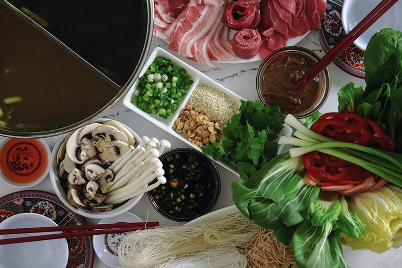 At its core, hot pot is a social experience where you cook raw foods in a communal pot of flavored broth or soup. It has many variations across almost every Asian country and a handful of European ones, as well.