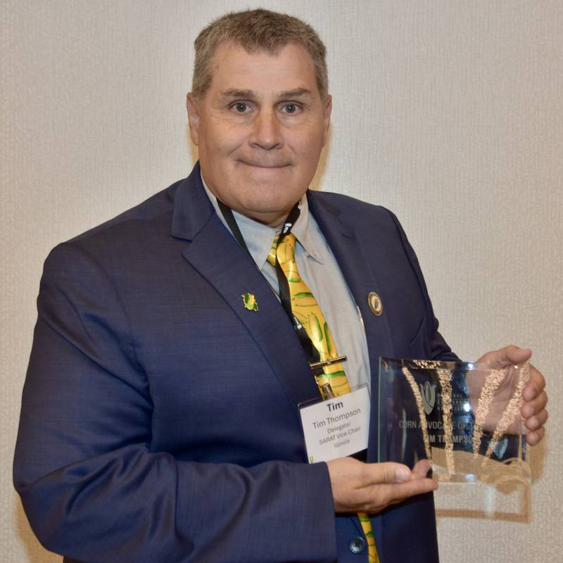 Tim Thompson, treasurer of the Illinois Corn Marketing Board, holds the Corn Advocate of the Year award he received during the National Corn Growers Association’s Corn Congress in Washington.