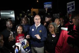 About 13,000 autoworkers go on strike seeking better wages and benefits