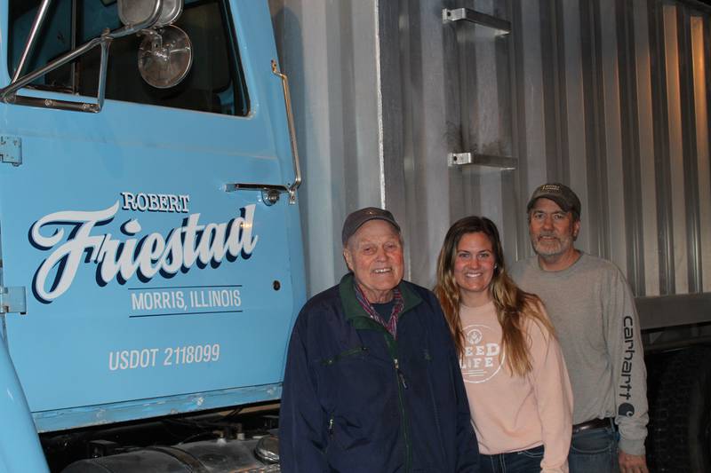 Bob Friestad (from left), his granddaughter, Marissa, and son, Scott, farm together near Morris, in northeastern Illinois, growing corn and soybeans. Bob purchased this grain truck that the family calls “Baby Blue” in the drought year of 1988 to haul his grain from the field to the local elevator.