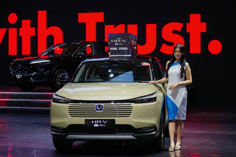 A model poses near a Honda HR-V car during the Indonesian International Motor Show in Jakarta, Indonesia.