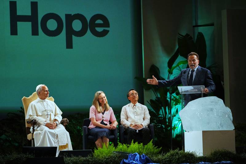 Arnold Schwarzenegger (right), actor and former Republican governor of California, delivers his speech at the international conference, Raising Hope for Climate Justice, attended by Pope Leo XIV in Castel Gandolfo, Italy.