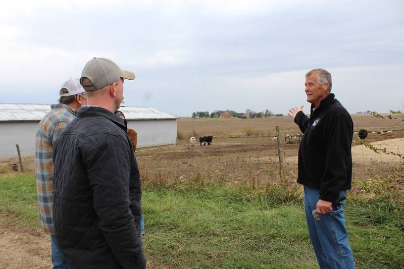 Dan Sanderson (right) talks about grazing cattle and sheep on his certified organic farm during a Pasture Walk. The family sells meat directly to consumers through bulk orders, as well as from their small farm store.