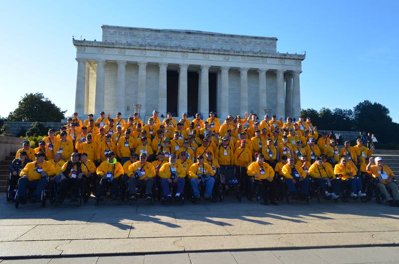 The veterans and guardians taking part in the Honor Flight of the Quad Cities pose in front of the Lincoln Memorial at the National Mall in Washington, D.C., on Tuesday, Nov. 8, 2022.
