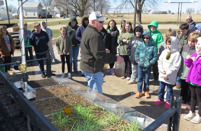 The Illinois Soybean Association’s mobile rainfall simulator and related demonstrations hit the road for a pre-season “tune-up” for St. Paul Grade School students in Odell. Agronomist John Pike operates the mobile unit and provides demonstrations throughout the year. He gave demonstrations to over 1,000 people last year.