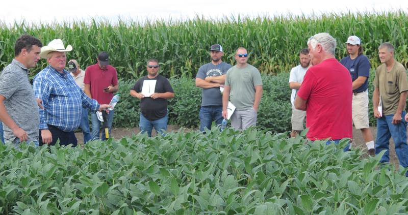Trent Nicholson (left), owner of Yield/Profit Challenge and a Pro-Soil Ag Solutions dealer, hosted a plot tour Aug. 20 at his farm in Eureka, Illinois. Lynn Hoover (second from left), Pro-Soil national field adviser and owner of Ocean Blue Agronomics, partnered with Nicholson to lead the tour that featured about 12 corn and as many soybean trials.
