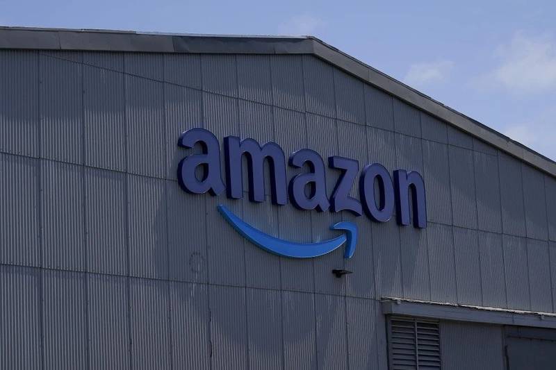 An Amazon sign is shown at a location in San Francisco. Amazon, will launch vehicle sales in the United States next year and allow local car dealers to sell directly to customers on its site. In a joint announcement with car manufacturer Hyundai on Nov. 16, the two companies said Amazon will begin by offering Hyundai vehicles.