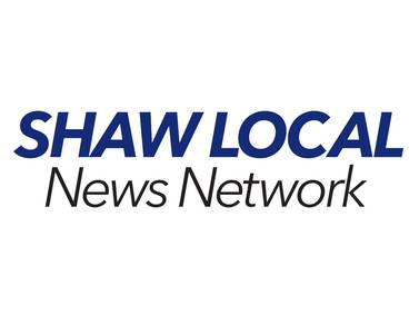 Two injured in a crash involving grain spreader and pickup truck