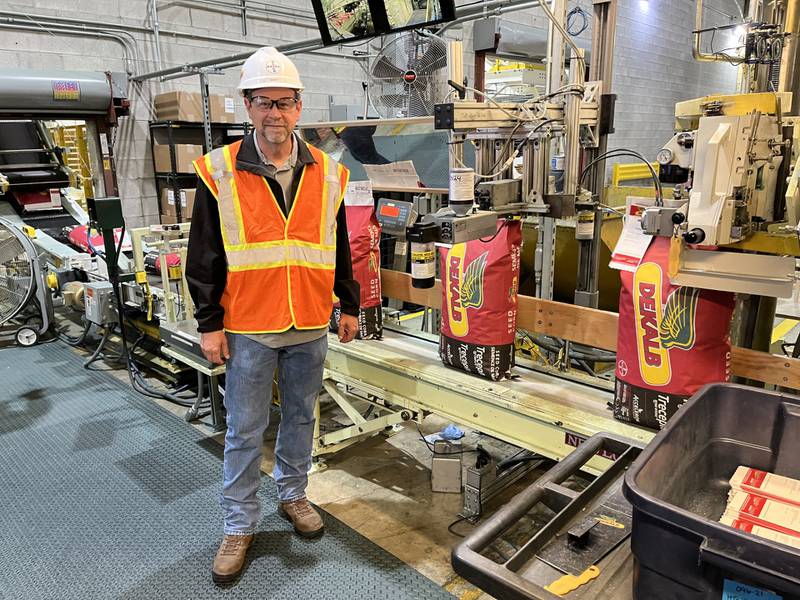 Barry Meyer, Bayer Constantine Corn Production Facility plant manager, leads a tour of the DEKALB seed processing plant. The facility produces about 2.5 million units — seed bags and bulk boxes — annually, representing 72% of Bayer’s national DEKALB corn brand.