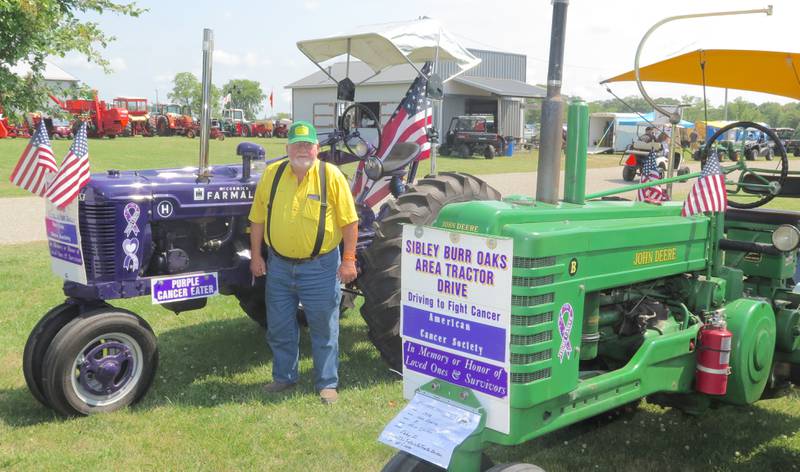 Russ Tjarks’ purple 1947 Farmall H tractor and 1952 John Deere B were on display during the recent Historic Farm Days at Penfield, Illinois. Tjarks coordinates the annual Sibley Burr Oaks Area Tractor Drive each summer with proceeds going to the American Cancer Society.