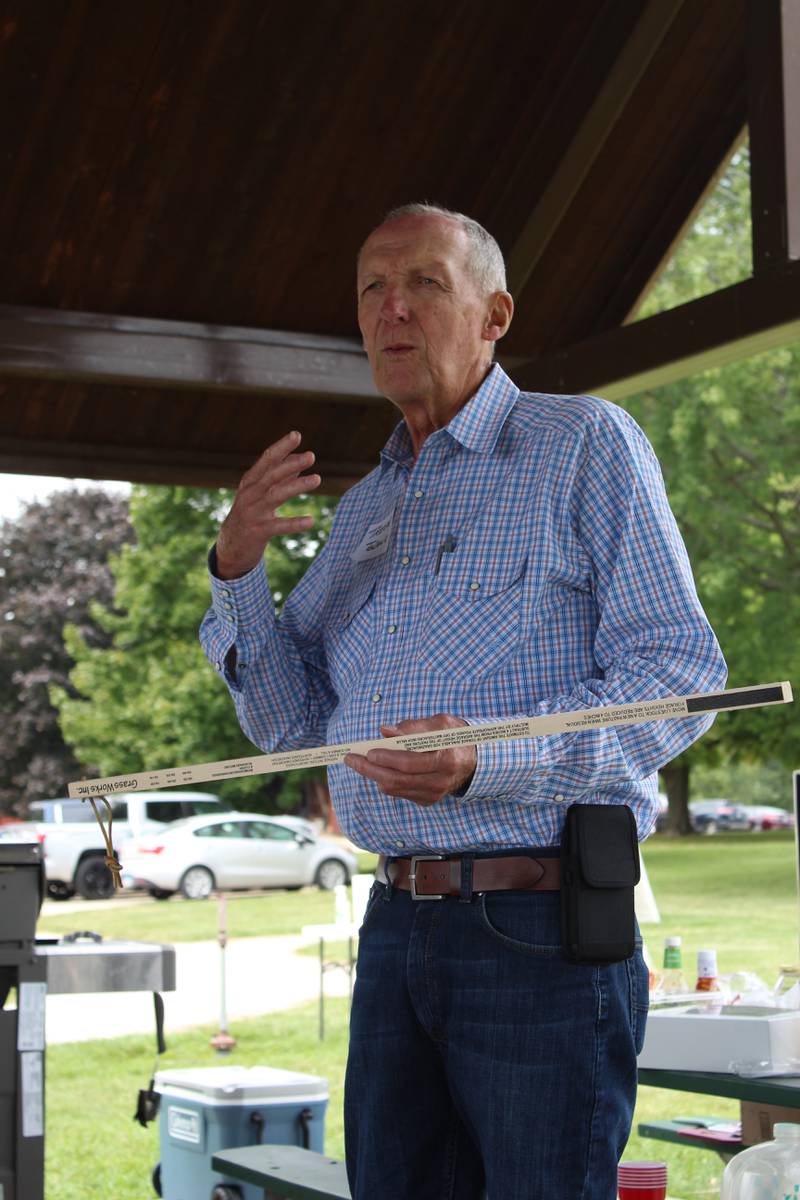 Trevor Toland explains how to use a grazing stick to estimate the amount of dry matter available in a pasture to get an idea of the number of cattle the forage can support in a grazing system. Observation is key, he said during the Regenerative Grazing School, to decide when to move cattle to the next paddock.