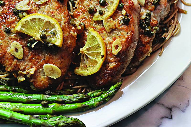 Pork chops in a lemon-caper sauce make an easy, restaurant-worthy dish made right at home.