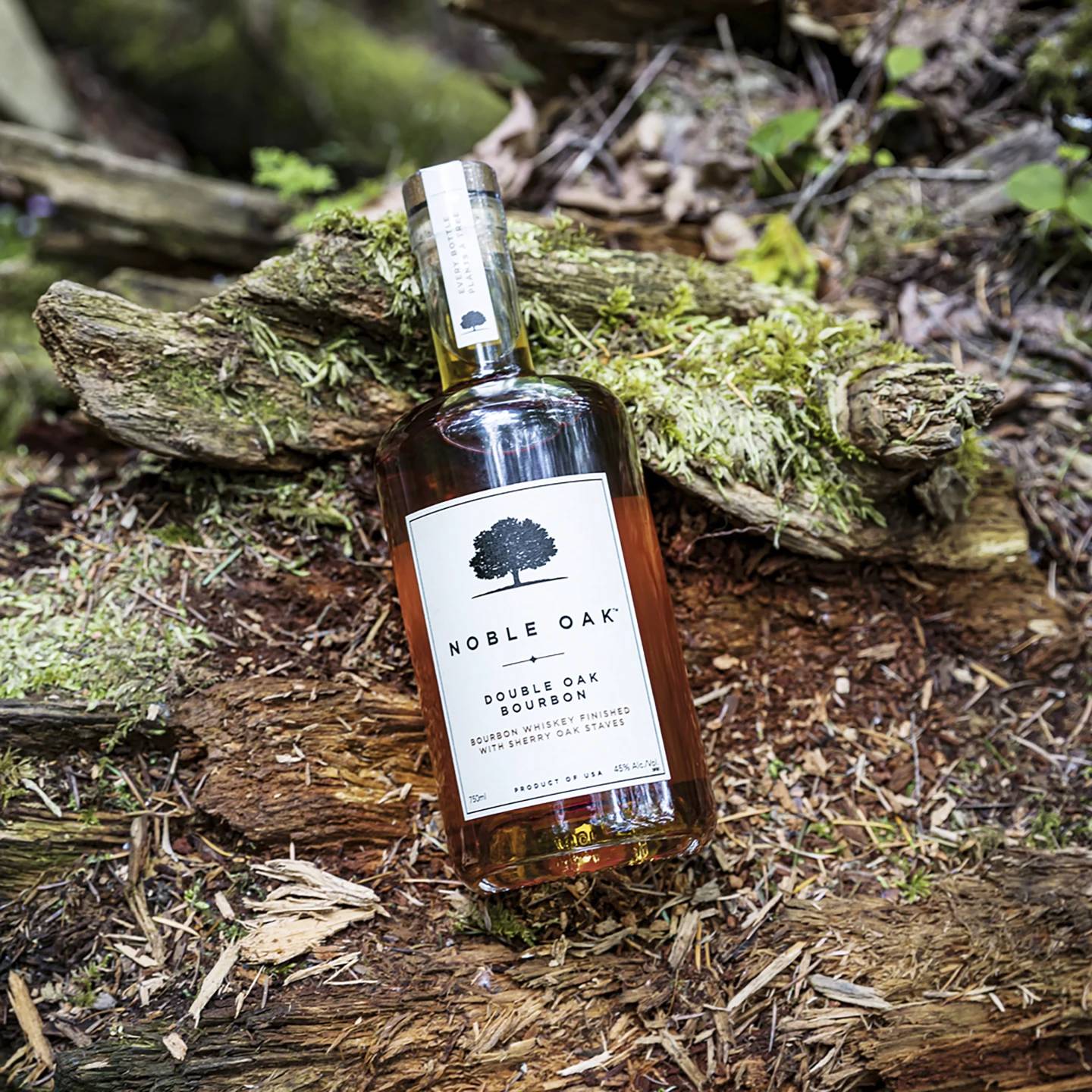 This image provided by Noble Oak shows a 750ml bottle of Noble Oak bourbon. For every bottle sold, the company plants a tree in partnership with One Tree Planted, a Vermont-based reforestation nonprofit.