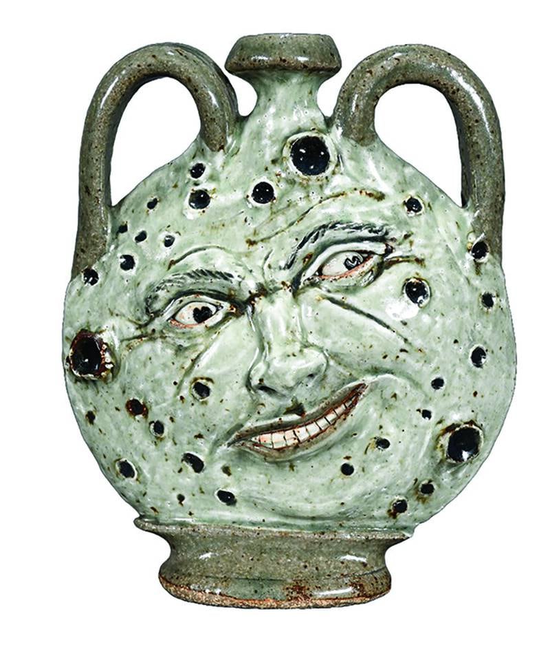 This contemporary man-in-the-moon jug recalls both Southern folk pottery and Chinese moon flasks.