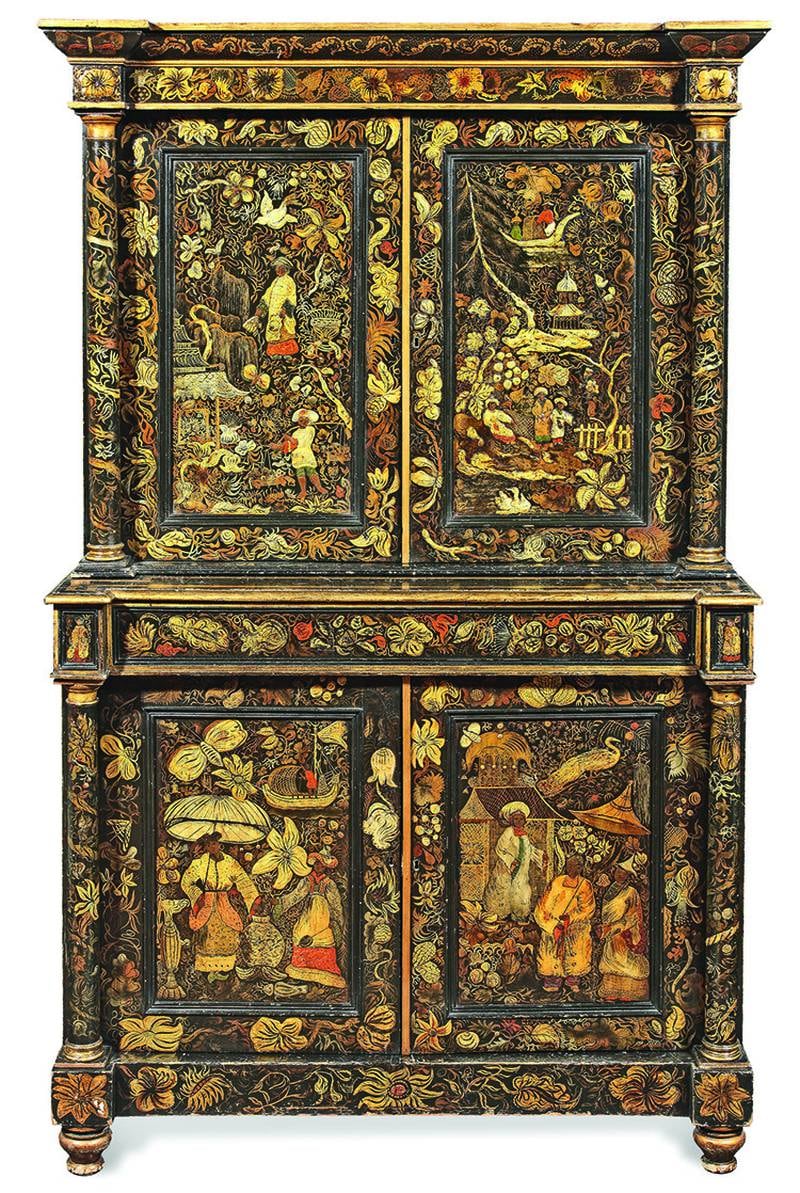 Repainting old furniture is nothing new. This cabinet was made around 1830, but the elaborate decorations were added later.