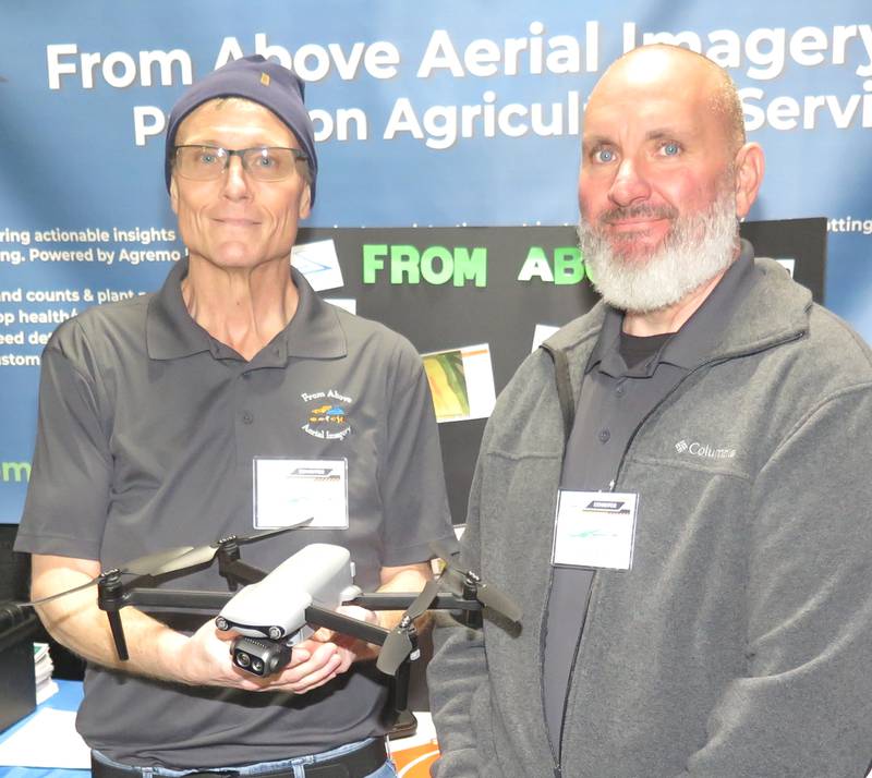 Dave Burt (left) and Justin Slade were at the From Above Aerial Imagery booth at the Midwest Ag Expo near Gifford in east-central Illinois. Burt is the company's operations manager and certified 107 remote pilot, and his wife, Bethany, is president and operations manager. Slade has seen the benefits From Above Aerial Imagery provides for farmers.