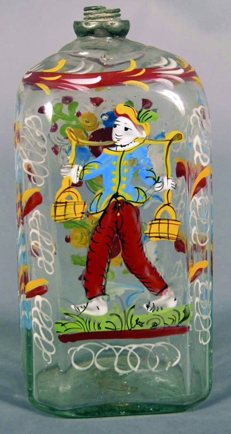 Glass like this enameled cologne bottle is usually called “Stiegel type” because it is virtually impossible to tell whether it was made by Henry William Stiegel or another glassmaker.