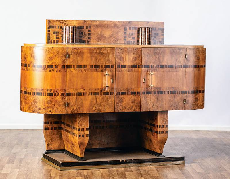 The art deco period began about 100 years ago and has not lost its appeal. This geometric cabinet with wood veneers is an example of the style.