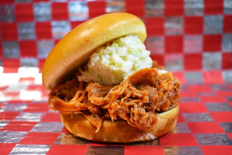 The Hog and Slaw by Indiana Pork Producers. Enjoy a classic favorite with a Hoosier twist. This pulled pork and coleslaw sandwich, presented by Indiana Pork Producers, features delicious pulled pork topped with crisp, creamy coleslaw for the perfect balance of savory and tangy flavors in every bite.