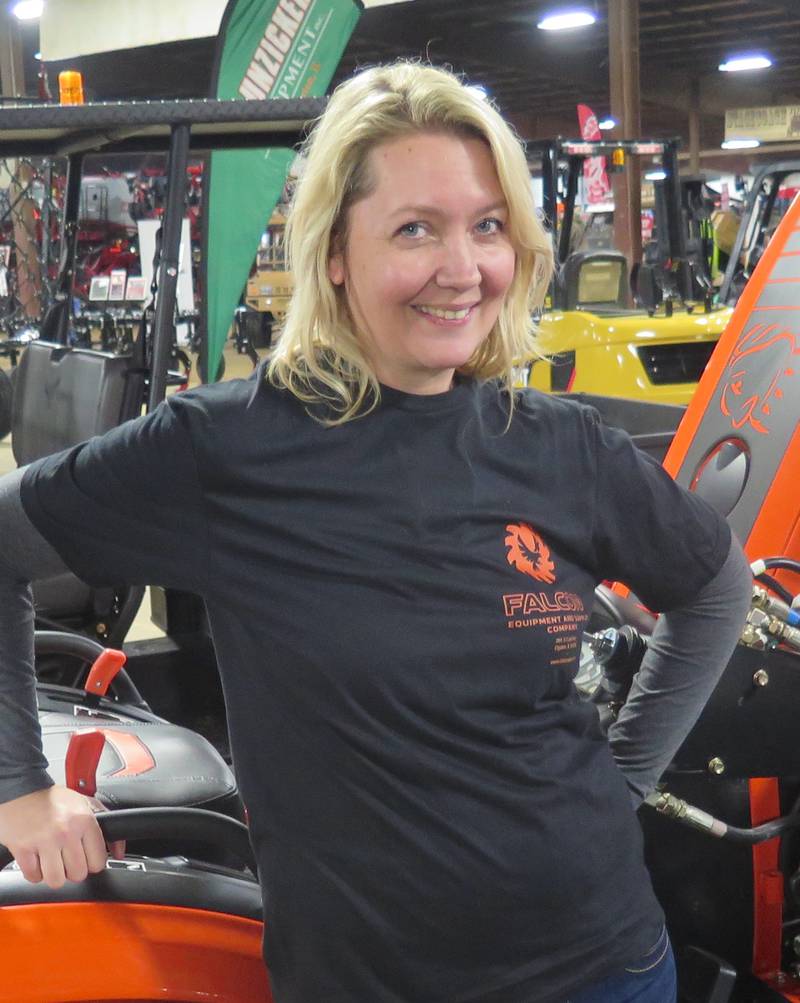 Lucinda Paganin, who co-owns Falcon Equipment and Supply Company with her brother, Matt Knoop, notes the new equipment featured at the Midwest Ag Expo.