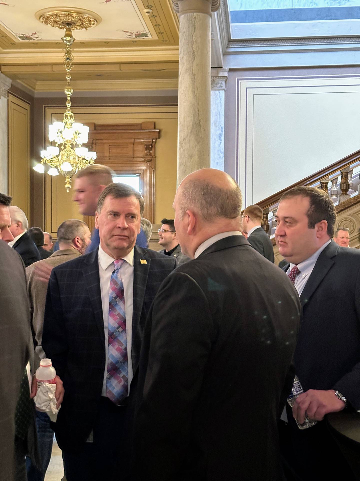 State Rep. Kendell Culp (left), R-Rensselaer, talks farm policy with Indiana farmers Chris Eck of Boggstown (center) and Bremen farmer Joe Stoller (right) during the Bacon Bar and Brunch legislative session on Feb. 5.