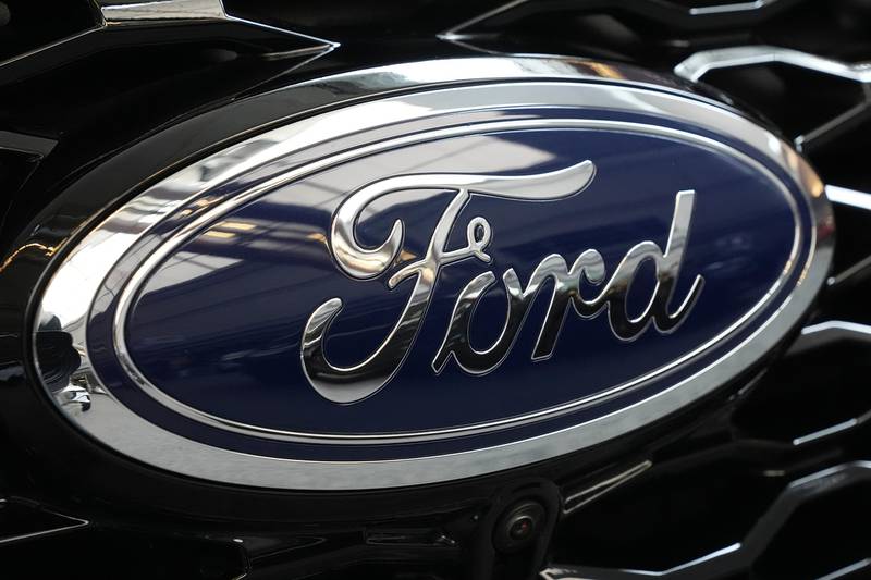 The Ford logo is seen on the grill of an Explorer.
