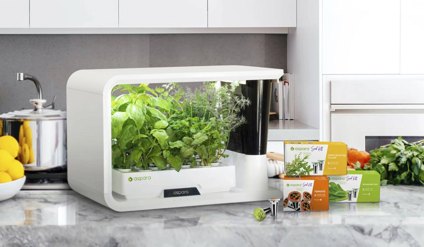 This image provided by Growgreen Limited shows an aspara Nature Smart Grower and packages of hydroponic seed kits.