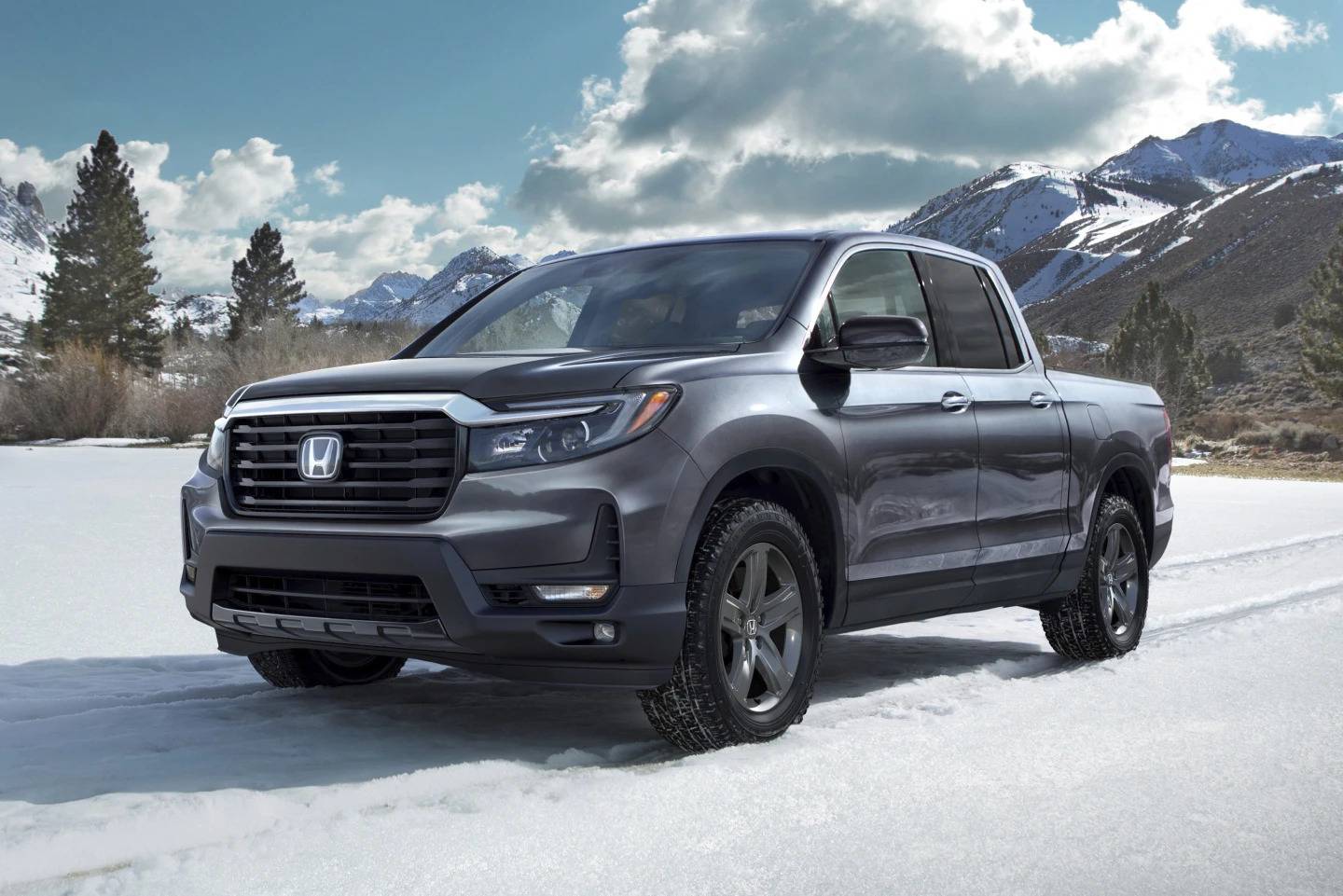 This photo shows a used Honda Ridgeline midsize pickup, which is available used for $25,000 or less.