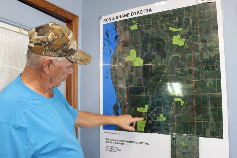 Ron Dykstra talks about the map hanging in the office of his shop that shows the locations of his farms. He started farming in 1972 by renting a farm and together with his wife, Marcia, expanded the operation which is located near the Mississippi River.